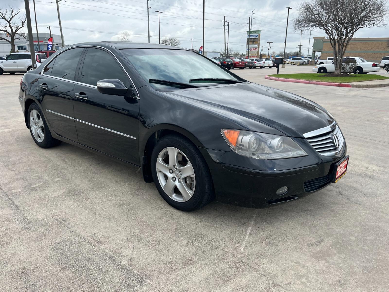 2005 Black /black Acura RL 3.5RL with Navigation System (JH4KB165X5C) with an 3.5L V6 SOHC 24V engine, 5-Speed Automatic Overdrive transmission, located at 14700 Tomball Parkway 249, Houston, TX, 77086, (281) 444-2200, 29.928619, -95.504074 - Photo #0